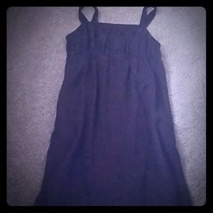 Linen sundress w/ side slit pockets.